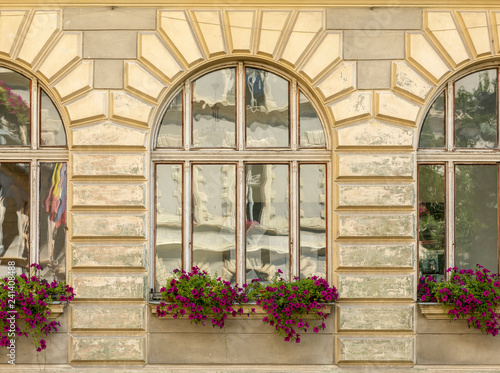 Fototapeta Naklejka Na Ścianę i Meble -  Window on the façade of a stone wall