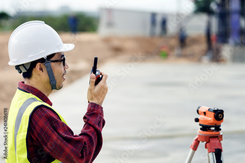 Engineers use radio to communicate in order to work at construction sites.Area theodolite