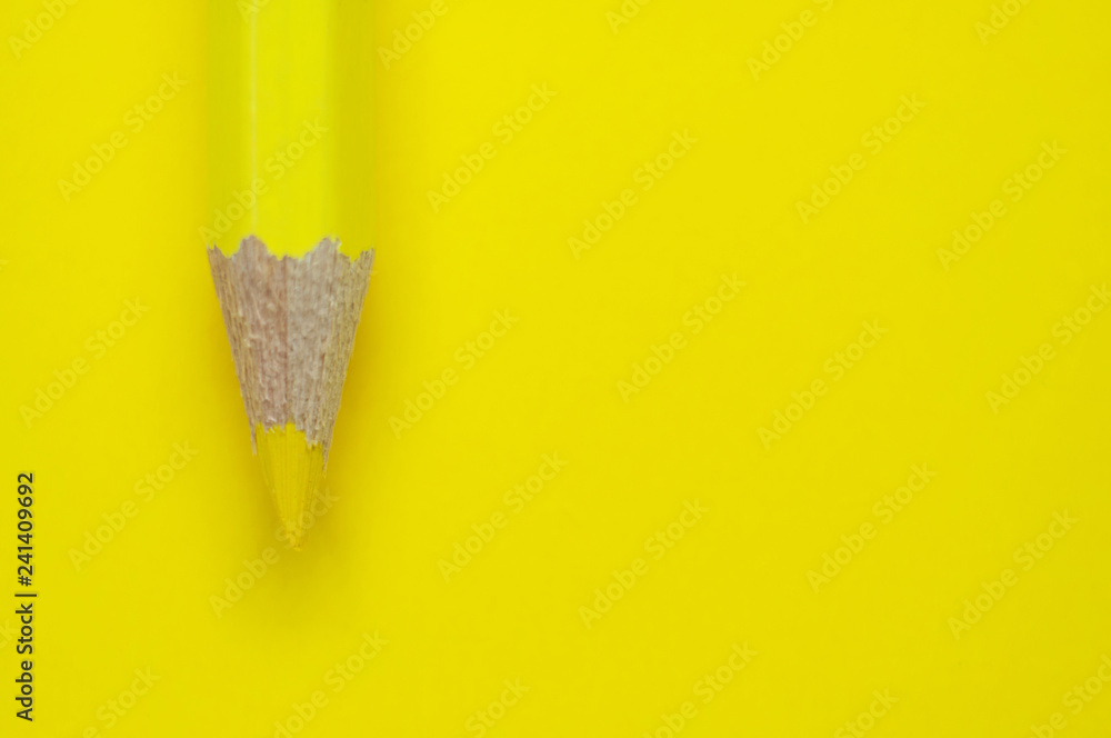 Macro photo of yellow pencil on yellow paper Macro photo of yellow pencil on yellow paper