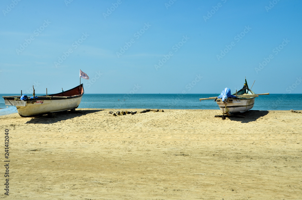 India, GOA, November 2018: boats stand on the shore. Fishing boats stand on the beach