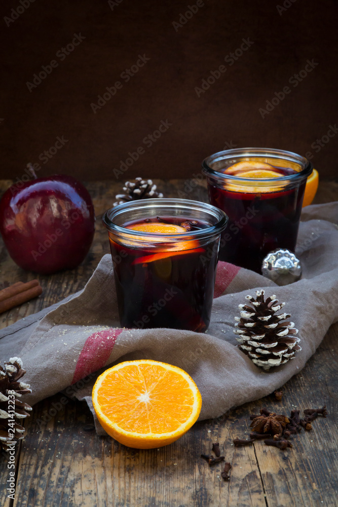 Two glasses of mulled wine with orange slices at Christmas time Two glasses of mulled wine with orange slices at Christmas time