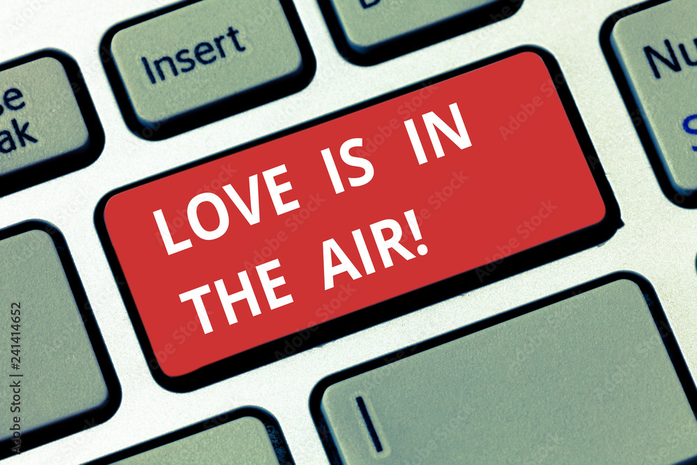 Text sign showing Love Is In The Air. Conceptual photo Roanalysistic emotions situations new couple relationships Keyboard key Intention to create computer message pressing keypad idea Text sign showing Love Is In The Air. Conceptual photo Roanalysistic emotions situations new couple relationships Keyboard key Intention to create computer message pressing keypad idea