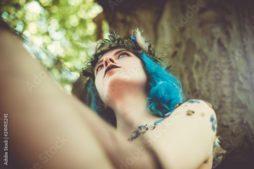 forest witch underneath the tree photo