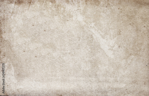 Old worn sand - colored paper with a dirty surface