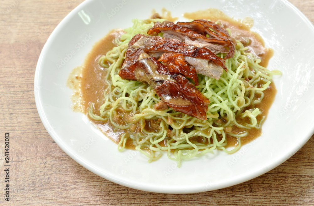 Chinese egg noodles topping slice roasted duck with soybean sauce