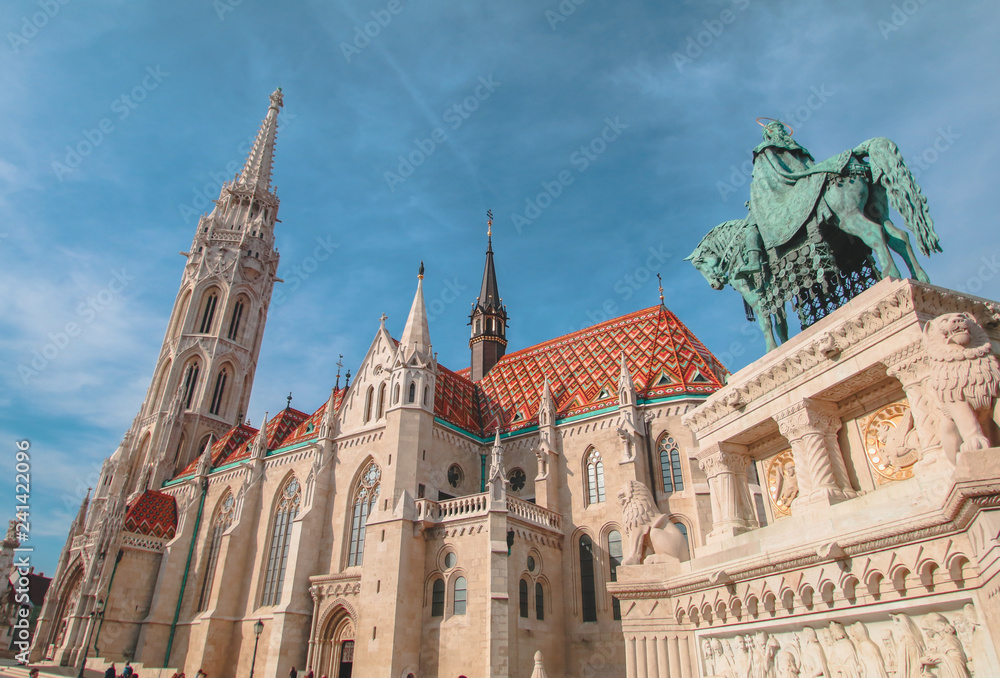 Fototapeta premium Budapest Mathias Church and St. Stephen's statue with blue sky
