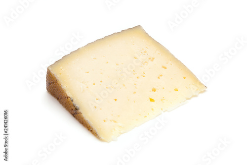 Spanish Manchego cheese produced in the La Mancha region of Spain, isolated on a white studio background.