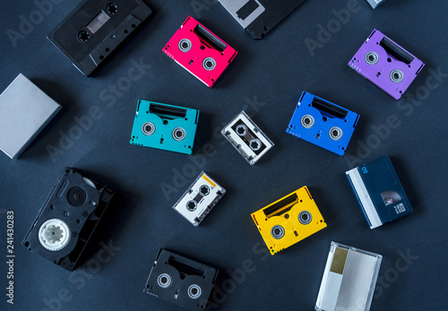 Minidv, DV,  microcassette, Audio cassette tapes. Isolated on black photo