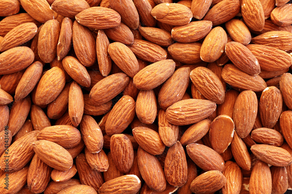Close up of shelled almonds with skins on Close up of shelled almonds with skins on