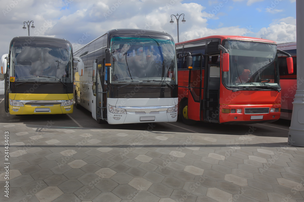 buses on parking on the background of cloudy sky