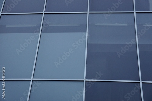 gray glass texture from multiple windows on the wall