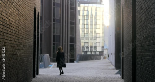 Wallpaper Mural Young woman walking on the street Torontodigital.ca