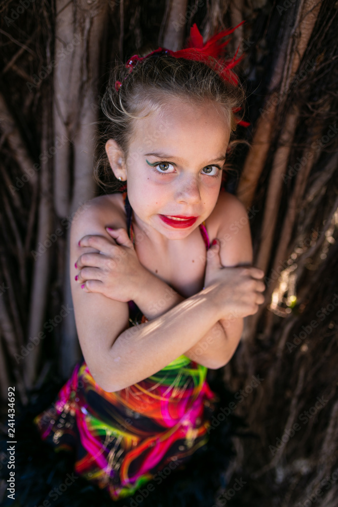  girl dressed as a dancer plays in the field