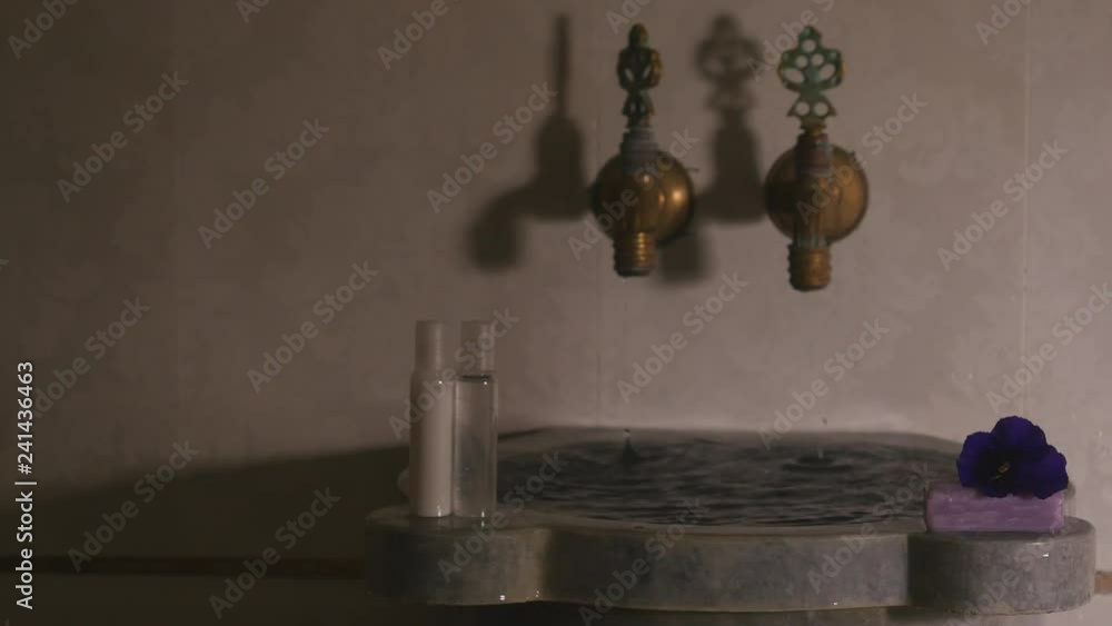 Water flowing from faucets and from marbel bowl in turkish bath. Water flowing from faucets and from marbel bowl in turkish bath.