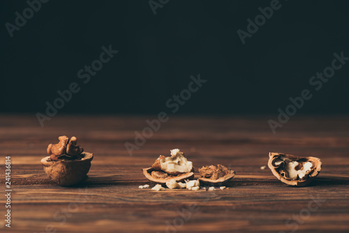 cracked walnuts as dementia symbol on wooden table