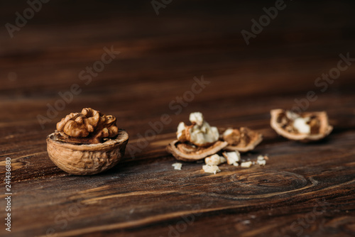 walnuts in nut shells as dementia symbol on wooden table