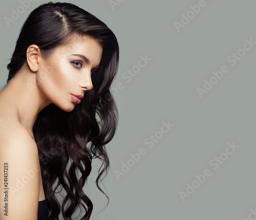 Brunette girl with long healthy hair, female profile