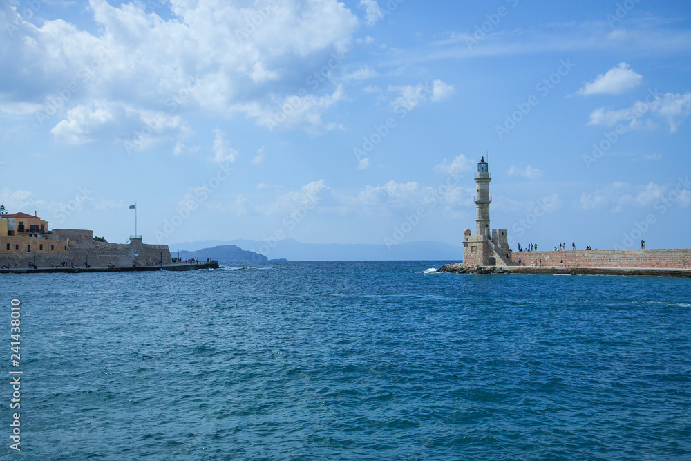 Beautiful cityscape and lighthouse. View of the old port of Chania, Crete, Greece.