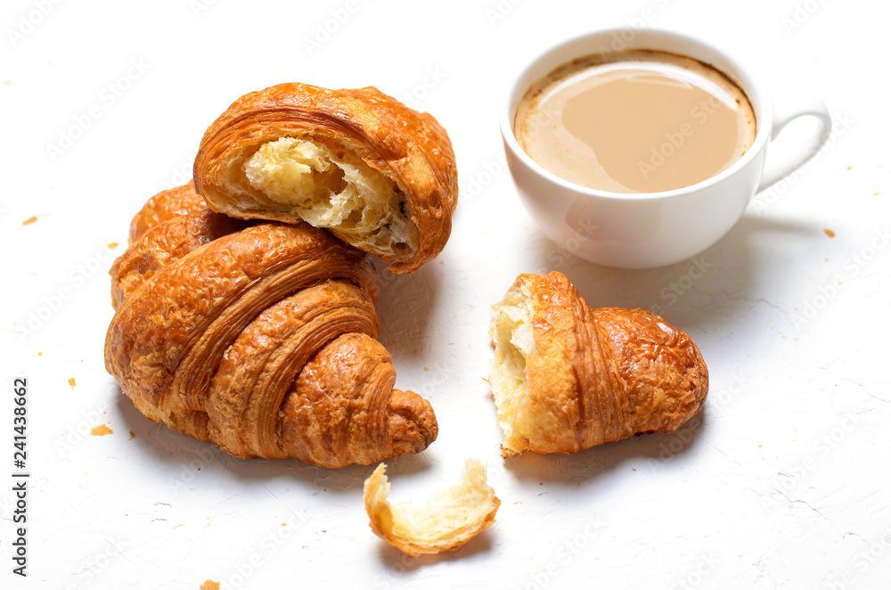 Croissants and Coffee Cup on White Background Croissants and Coffee Cup on White Background