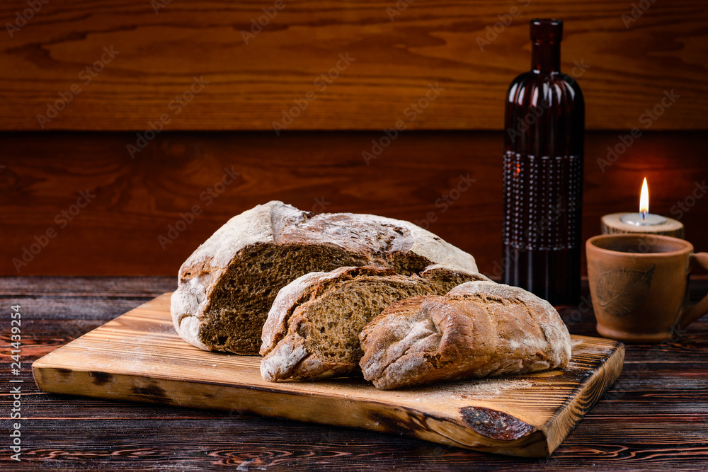 traditional homemade bread on wooden background, food closeup