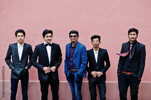Photography Group of 5 indian students in suits posed outdoor against pink wall