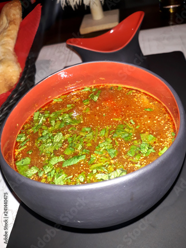 Soup kharcho. Georgian national cuisine. Spicy soup with beef, rice, walnuts and tkemali sauce. Liberally seasoned with garlic and greens.
