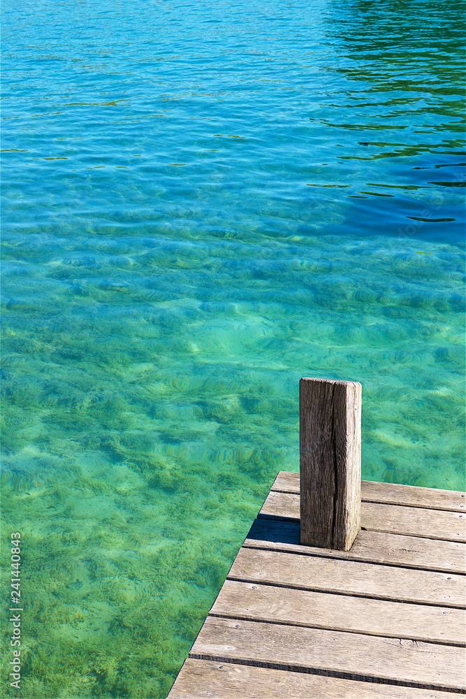 wooden pier and turquoise water.