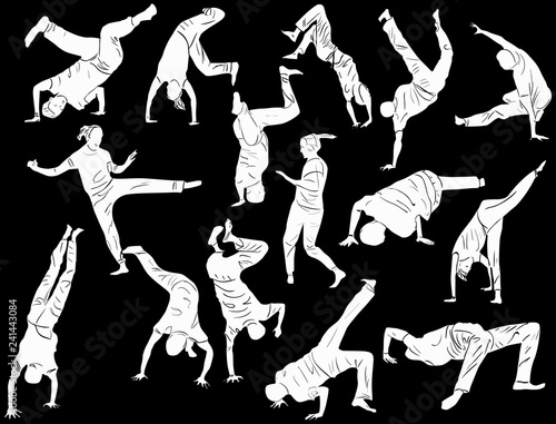 breakdancers silhouettes isolated on black photo