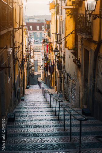 Beautiful Staircase in Lisbon. Hanging laundry in typical narrow street. Sunset in the old downtown of Lisbon  cityscape of Lissabon