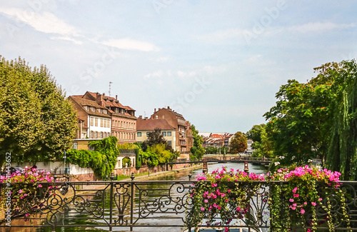 Beautiful buildings along the  River in central Strasbourg in the Alsace region of France. Many structures are of the traditional half timbered architecture. 