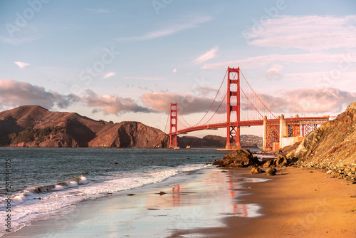 Golden gate bridge at golden hour view from Marshal's beach. photo