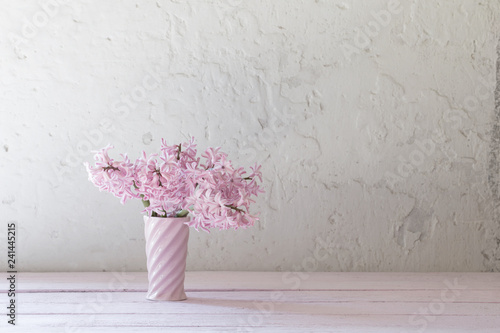 Fototapeta Naklejka Na Ścianę i Meble -  pink hyacinths in vase on white background