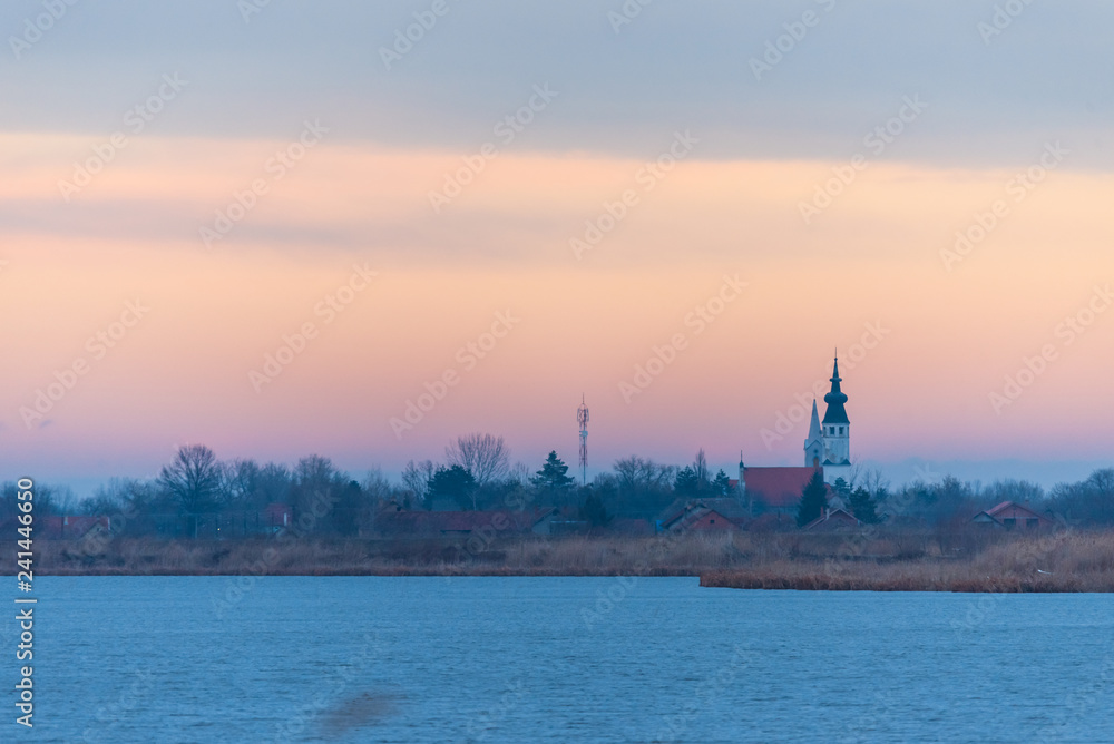 two churches in the village by the lake