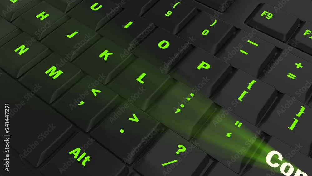 pointing the camera on green glowing Comment key on black computer keyboard pointing the camera on green glowing Comment key on black computer keyboard