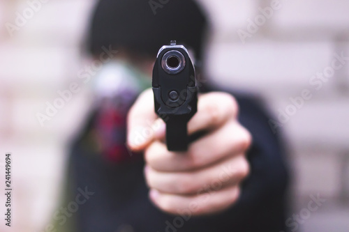 Man with a gun, crime concept