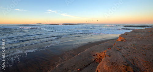 Morning sunrise view of Santa Clara river flowing into Pacific ocean on the gold coast of California at Ventura California United States photo