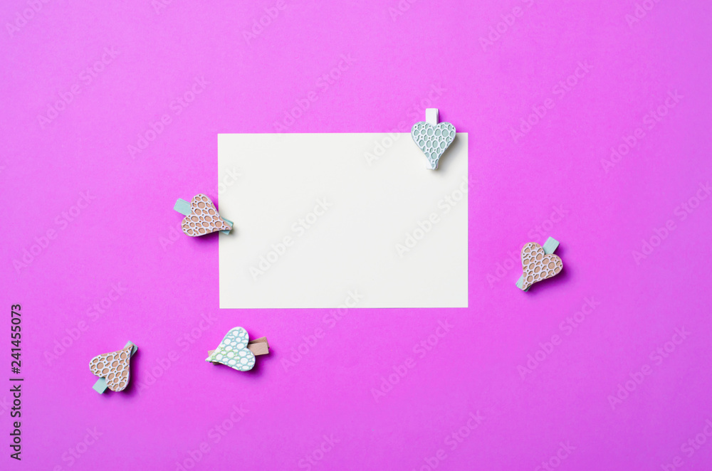 White Blank Paper on Purple Background and Heart Shaped Pins, Top View