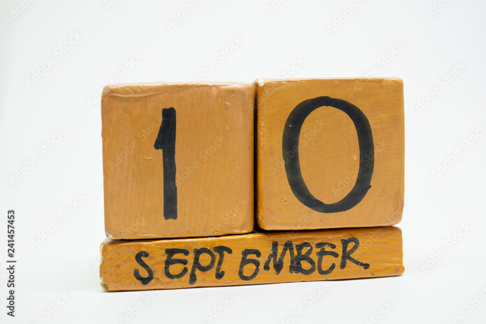 september 10th. Day 10 of month, handmade wood calendar isolated on white background. autumn month, day of the year concept september 10th. Day 10 of month, handmade wood calendar isolated on white background. autumn month, day of the year concept