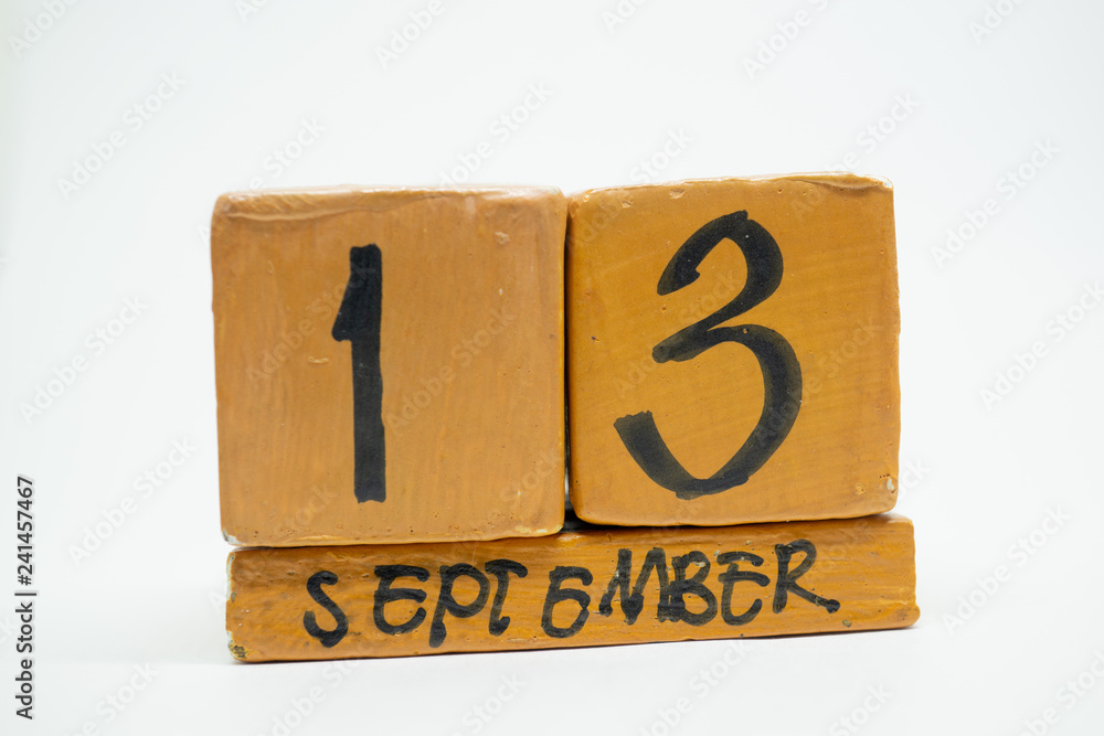 september 13th. Day 13 of month, handmade wood calendar isolated on white background. autumn month, day of the year concept september 13th. Day 13 of month, handmade wood calendar isolated on white background. autumn month, day of the year concept