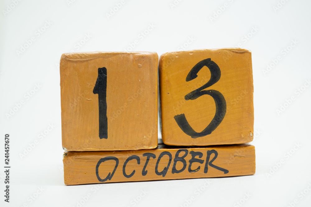 october 13th. Day 13 of month, handmade wood calendar isolated on white background. autumn month, day of the year concept october 13th. Day 13 of month, handmade wood calendar isolated on white background. autumn month, day of the year concept