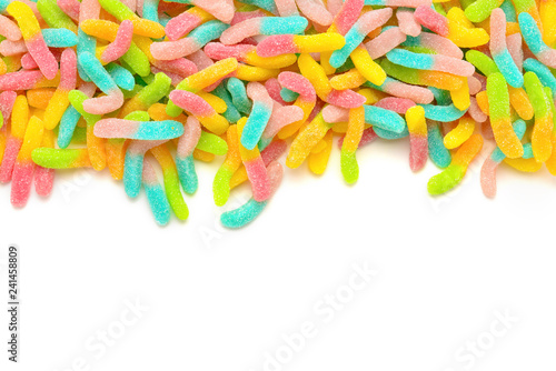 Frame of colorful gummy candies isolated on white. Top view. Space for text or design.