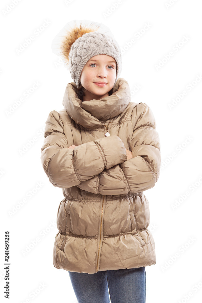 Cute teen girl in winter jacket and hat, isolated on white background Cute teen girl in winter jacket and hat, isolated on white background