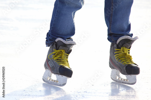 Feet skating on the ice rink