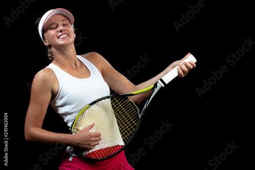 Smiling tennis player playing on racket as on guitar
