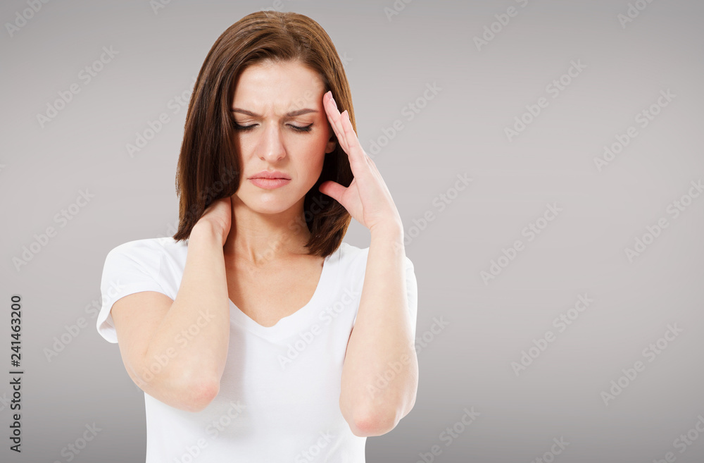 suffering brunette woman on grey background, headaches suffering brunette woman on grey background, headaches