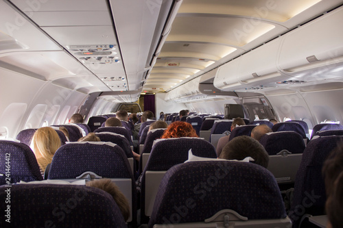 interior of a plane with people