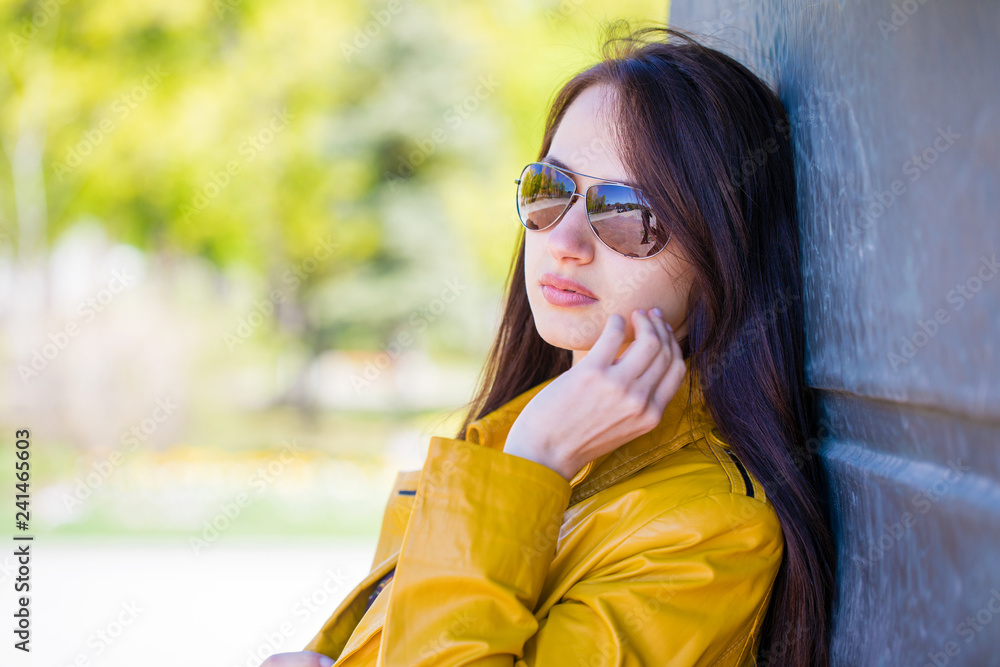 Portrait of a young beautiful brunette in mirrored sunglasses Portrait of a young beautiful brunette in mirrored sunglasses