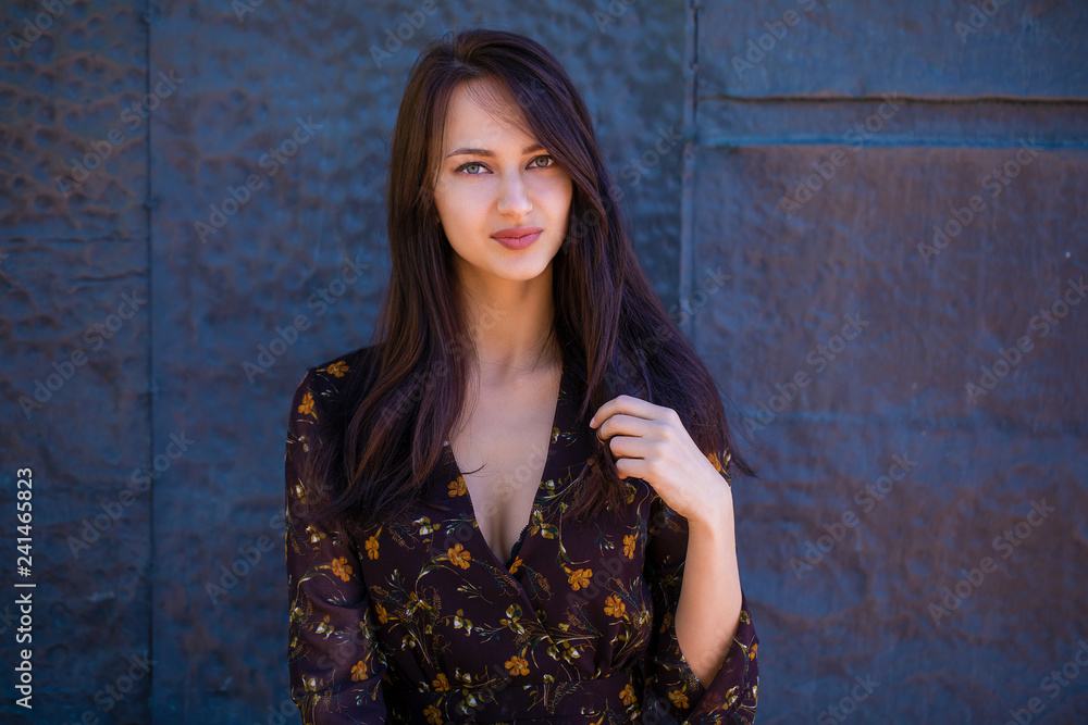 Beautiful brunette woman in sexy brown dress Beautiful brunette woman in sexy brown dress