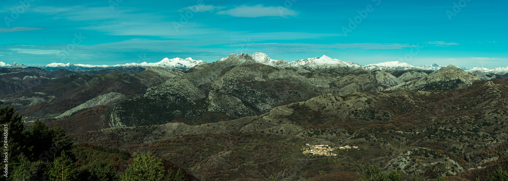 panorama snowy mountain top on sunny day in spain