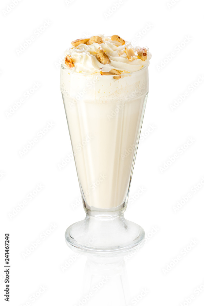 A delicious cold milk shake decorated with walnuts. Isolated on white. A delicious cold milk shake decorated with walnuts. Isolated on white.
